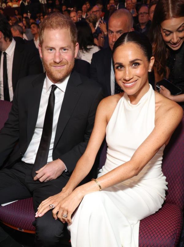 Prince Harry, Duke of Sussex, on stage at the 2024 ESPY Awards in Hollywood, California, accepting the Pat Tillman Award while holding a trophy