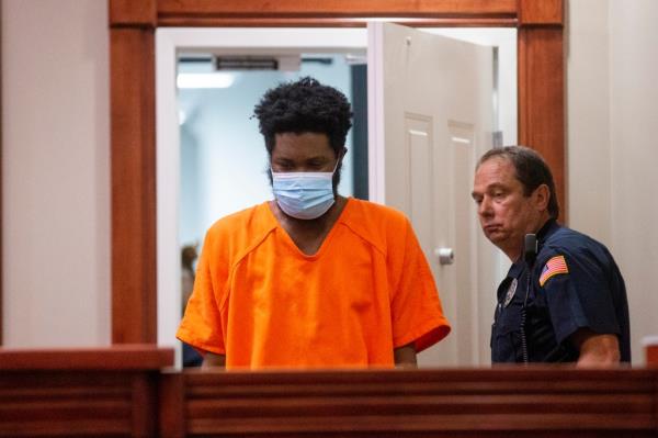 Larry Pickens, the man charged with first-degree murder and aggravated assault for the shooting of Dr. Benjamin Mauck, stands in the courtroom for his arraignment at the Collierville Municipal Court in Collierville, Tenn., on Thursday.