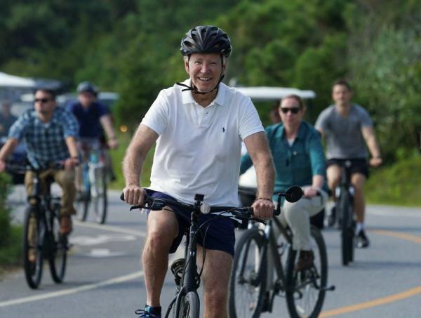 President Joe Biden goes for a bike ride at Gordons Pond State Park Area in Rehoboth Beach, Delaware, U.S., August 11, 2024.